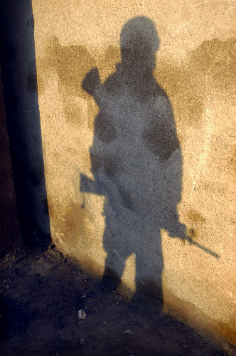 Specialist Jean Robenson's shadow (taking cover after an IED attack, Ar Ramadi, Iraq)