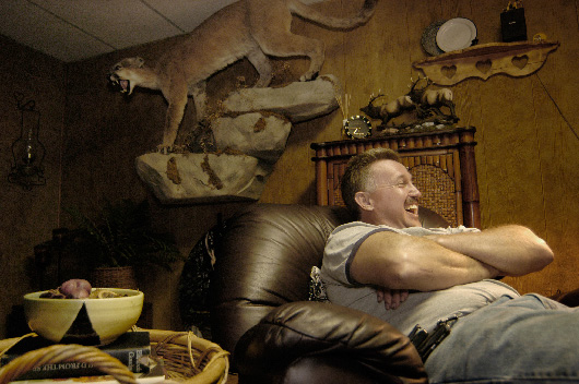 Larry Goldizen and his stuffed cougar, Liberty, West Virginia